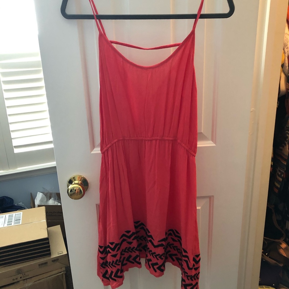 Coral sundress with black pattern